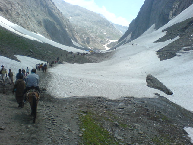 Pilgrims walking the Amarnath yatra route through the Kashmir mountains